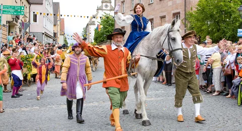 Culture - women is riding through the City