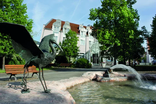 outside parkhotel altmühltal with "Storchenbrunnen"